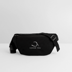Sac banane COVER YOU noir posé de trois-quarts, sangle et boucle à clip visibles